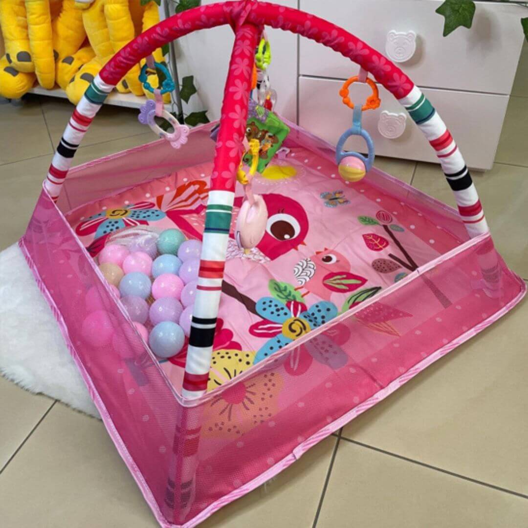 Arche-d'éveil-rose-pastel-aire-de-jeu